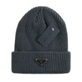 Triangular dark gray knitted hat