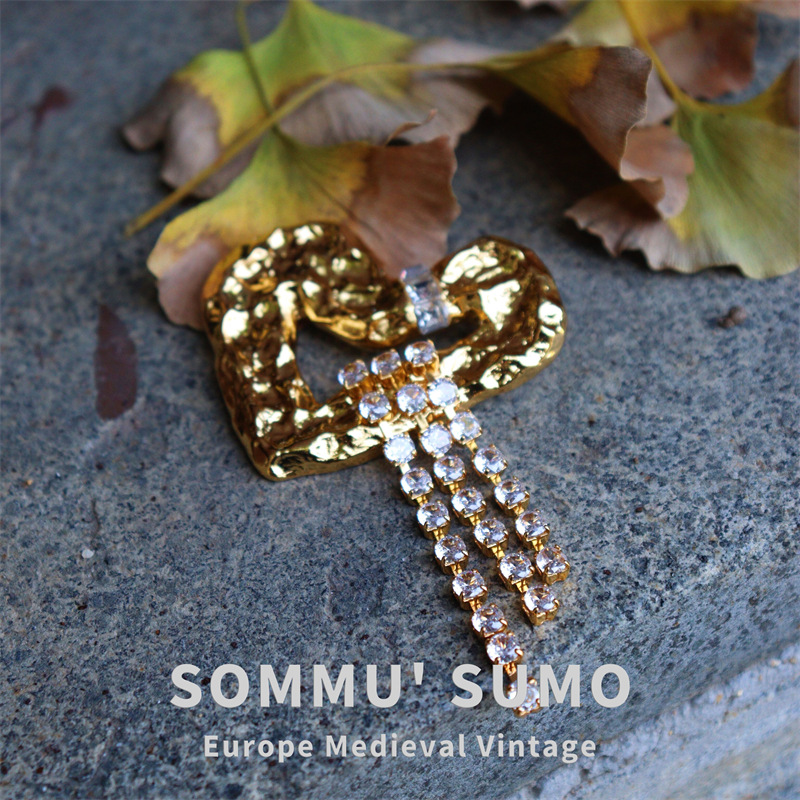 Antique retro brooch with tassels