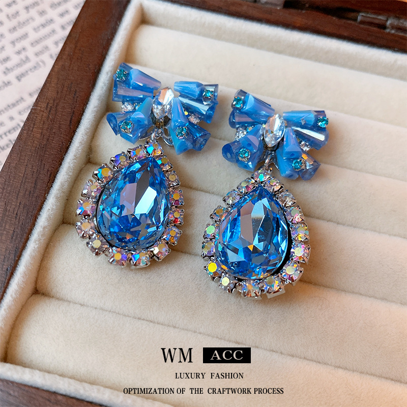 elegant fashionable earrings with bow drop-shaped