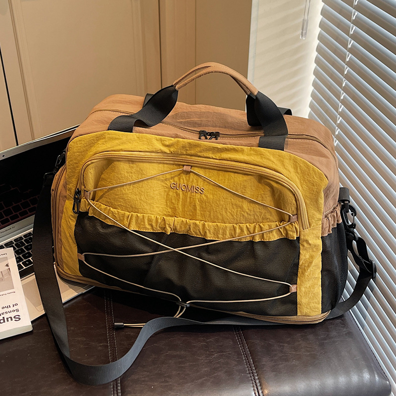 Nicho de diseño de moda moda moda bolsa de mano de mujer gran capacidad bolsa de viaje corto bolsa de almacenamiento bolsa de viaje deportiva al aire libre