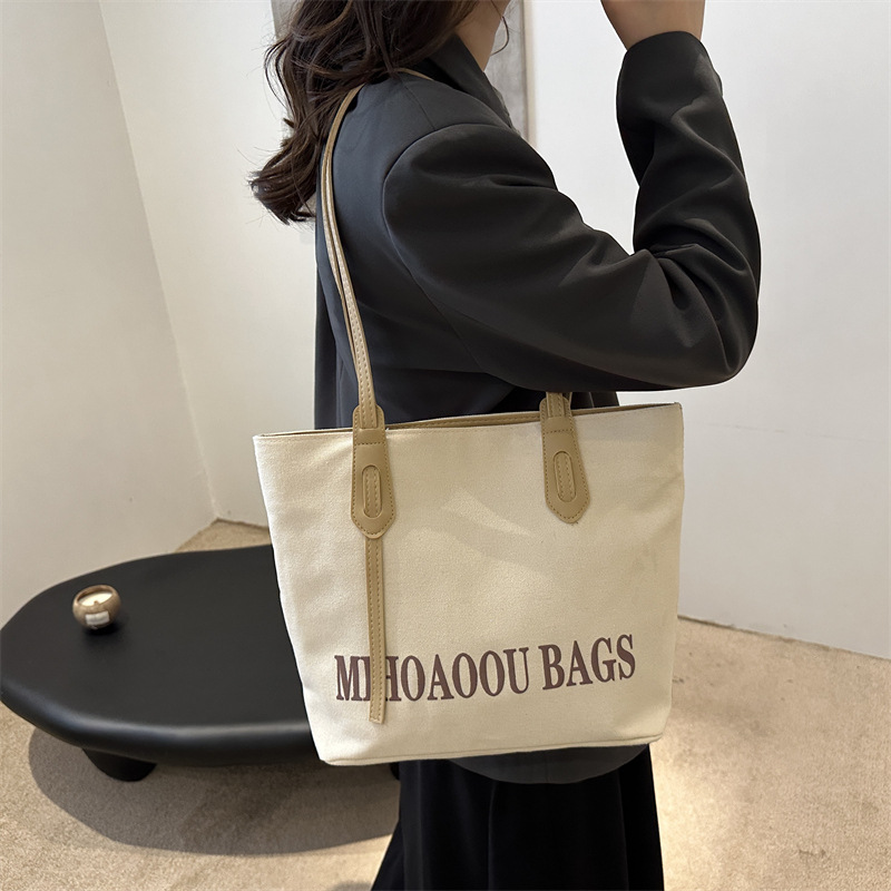 Bolsa de gran capacidad para mujeres 2024 otoño nuevo estilo de bolsa de lona universal bolso de hombro de viaje de estudiantes universitarios bolso de clase