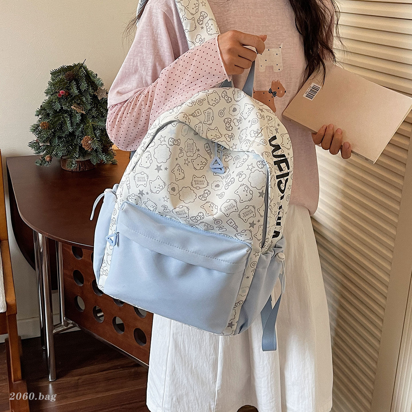 Bolsa de escuela secundaria de dibujos animados universales 2026 viaje ocio nueva mochila de gran capacidad impresión popular