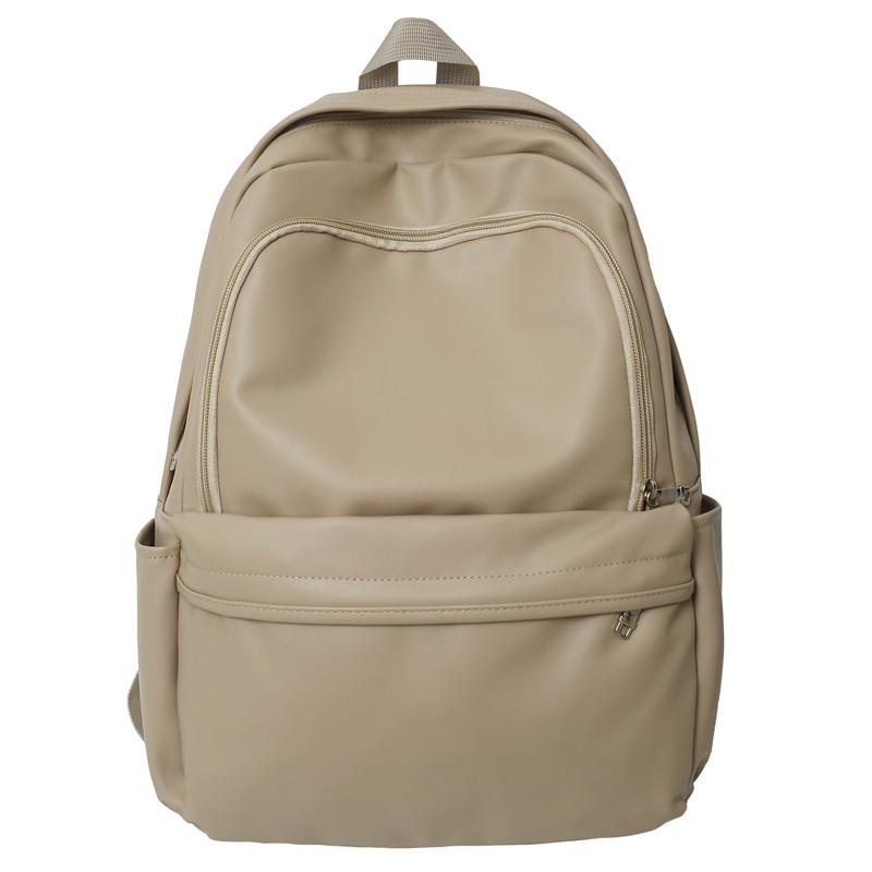 Comercio exterior nuevo estilo cuero suave gran capacidad color sólido escuela de secundaria mochila de moda masculina todo fósforo mochila simple japonesa