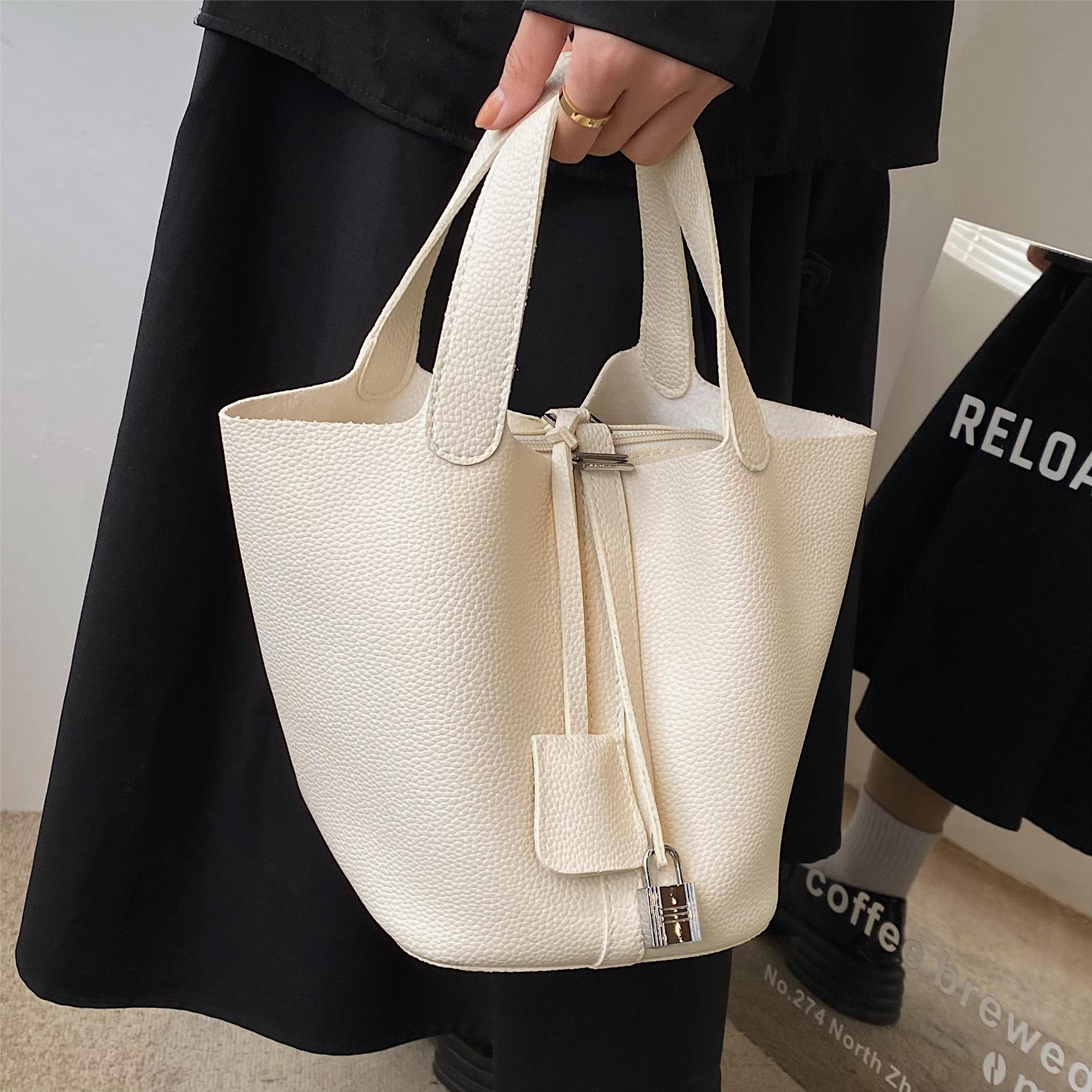 Bolsa de diseño de nicho de alta gama para mujeres 2023 nueva moda de moda simple bolsa de cubo popular bolsa de cesta de verduras portátil