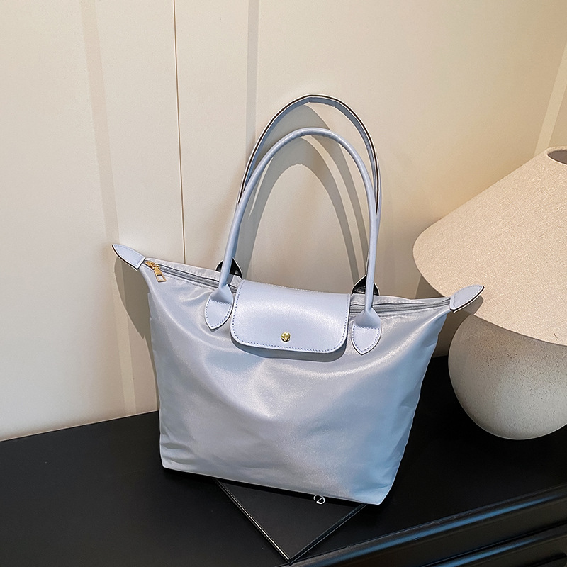 Bolso de hombro casual de gran capacidad para mujer 2025 nuevo bolso de nylon simple costura bolso portátil para axila