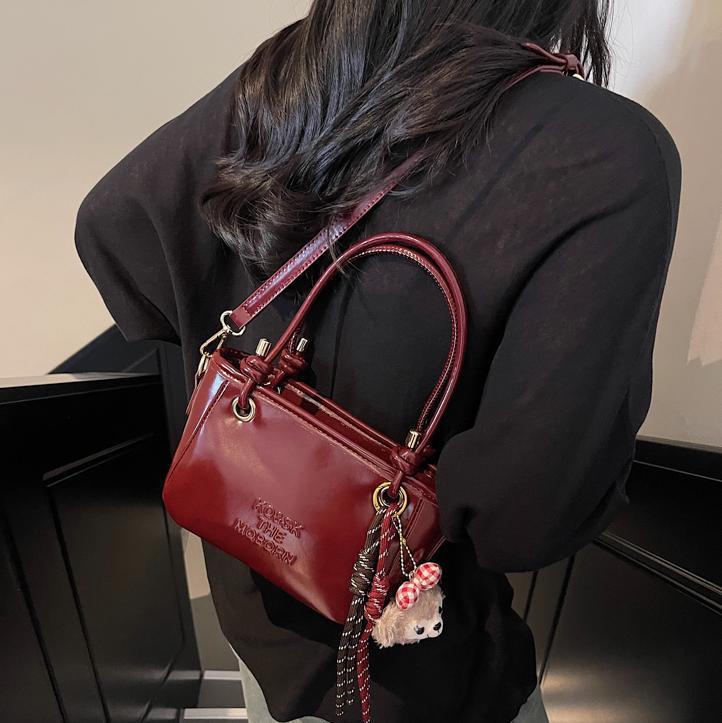 Bolsa de cubo retro explosiva para mujeres 2025 nuevo bolso de nicho de diseño de alta humedad versátil bolso de hombro