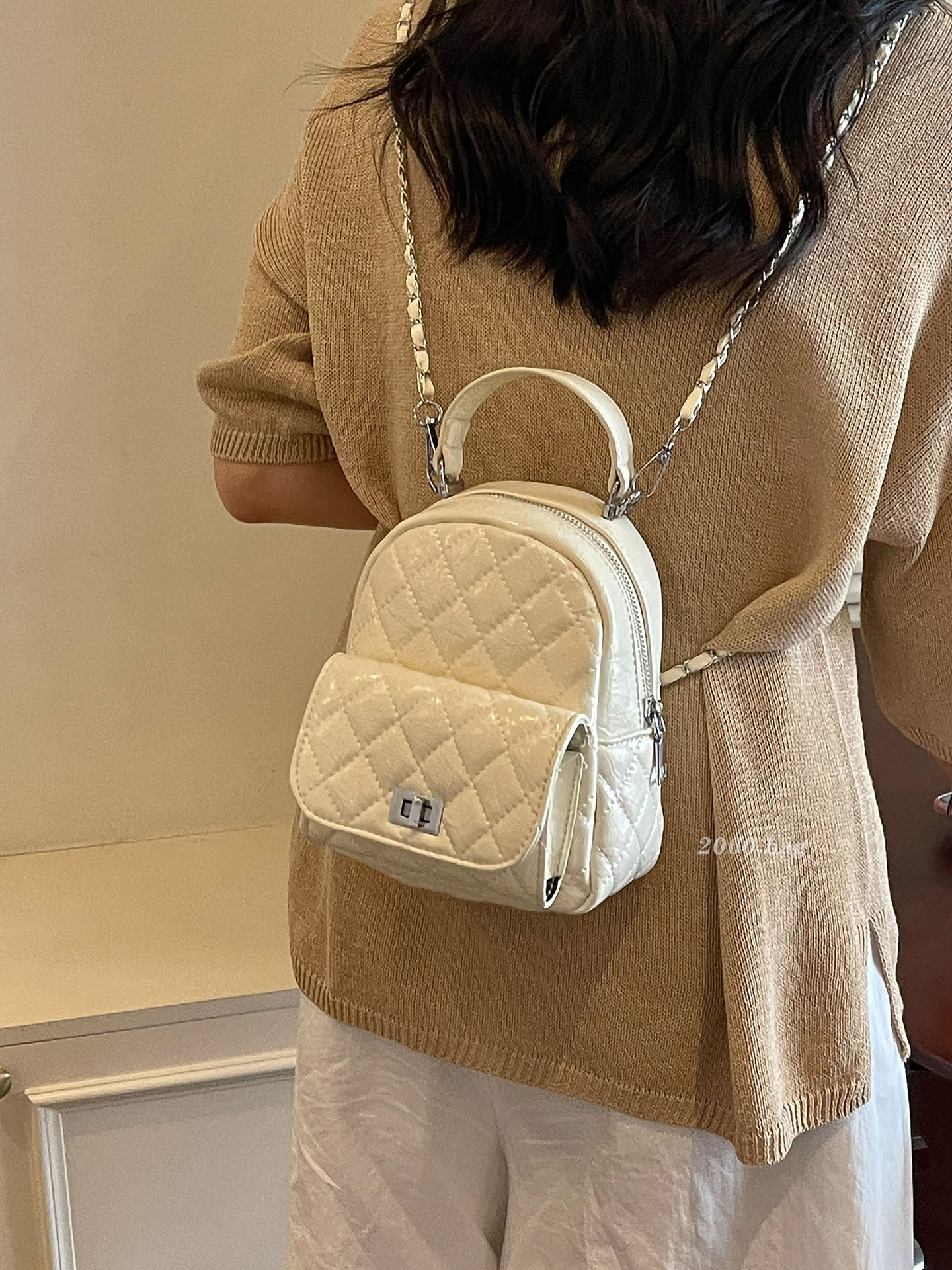 Bolsa de cadena de mochila, bolso pequeño, nuevo temperamento, estilo de ocio femenino, estilo de ocio femenino, 2026 universidad, viajes coreanos.