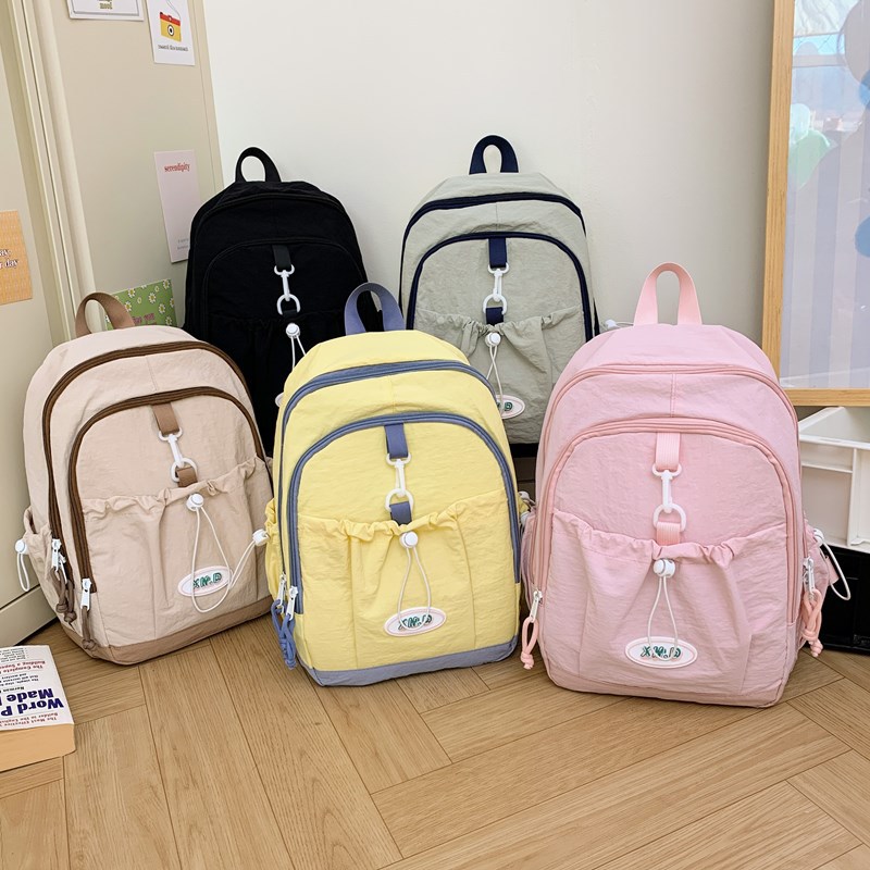 Coreana simple color sólido mochila de niños y niñas de gran capacidad mochila escolar 2026 nueva mochila de niños de cuerda