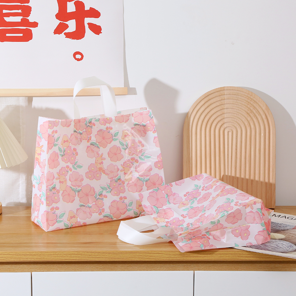 Bolsas de regalo de plástico personalizadas impresión logotipo bolsas de ropa personalizadas bolsas de goma de compras ropa de mujer portátil