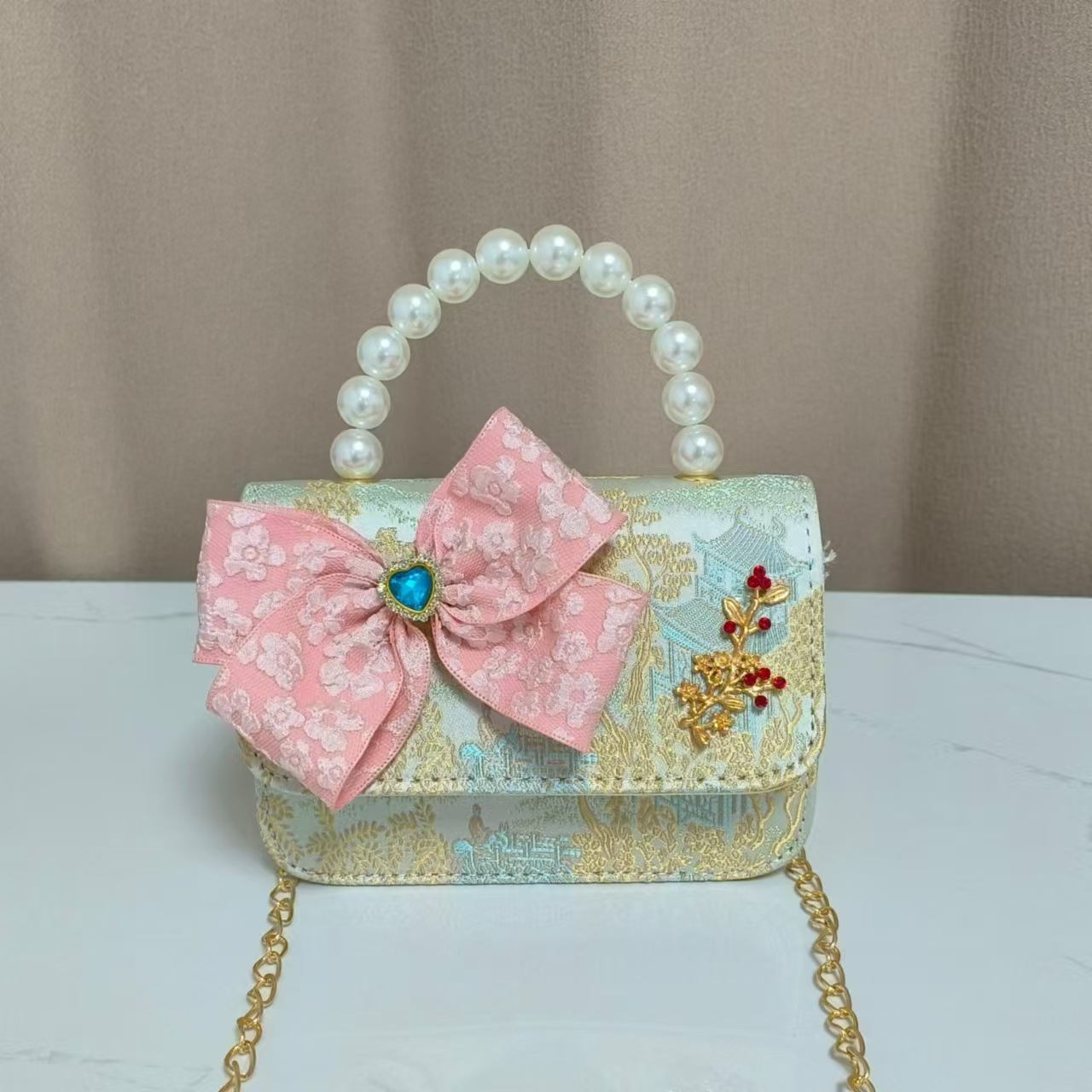 Bolso infantil nuevo bolso de hombro de niñas lindos bolsos de perlas de princesa arco de mariposa estilo nacional bolso de mochila pequeña bolsa