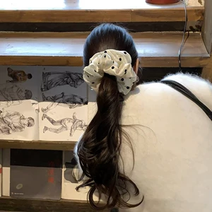 The texture is amazing! The pearlescent dots give it a classy look. This scrunchie is a stylish Korean fashion hair accessory for women