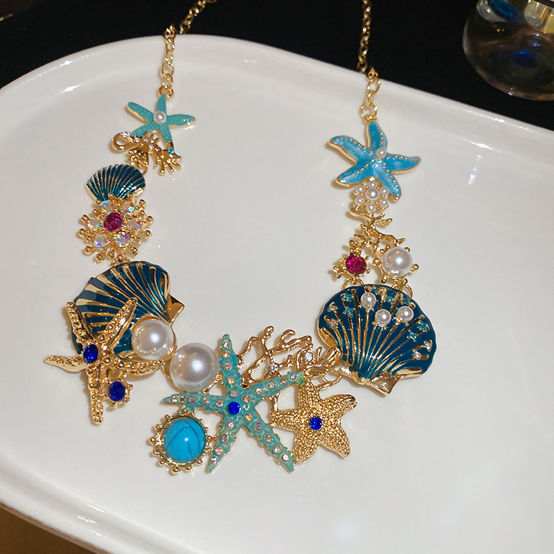 Collar de pendientes de coral de concha de estrella de mar goteando aceite, cadena de clavícula de todo fósforo de moda europea y americana, traje de nicho, lujo ligero, sentido de alta gama