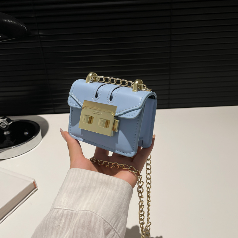 2024 principios de otoño nueva cadena de viaje bolso pequeño nicho personalidad ins cadena de hombro mini bolsa de cambio