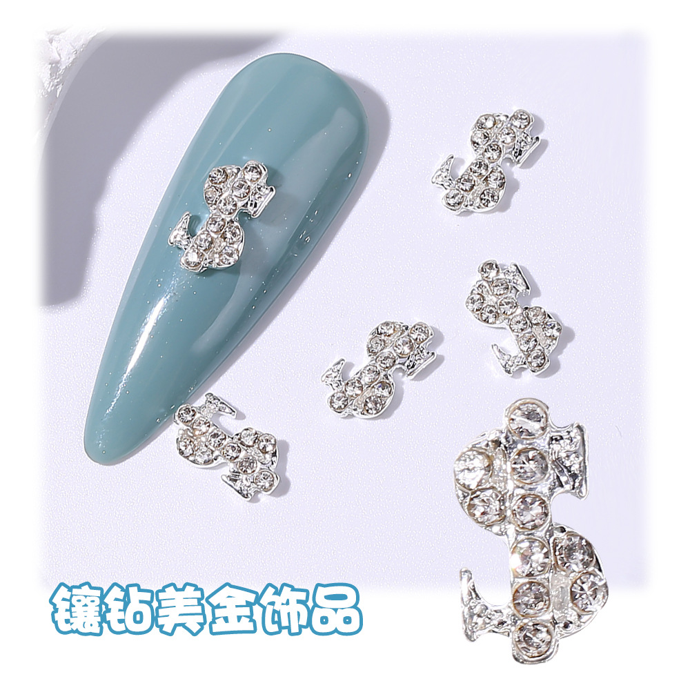 Joyería de uñas transfronteriza oro plata dólar símbolo moneda símbolo de uñas Luz de lujo flash diamante tridimensional decoración de diamantes
