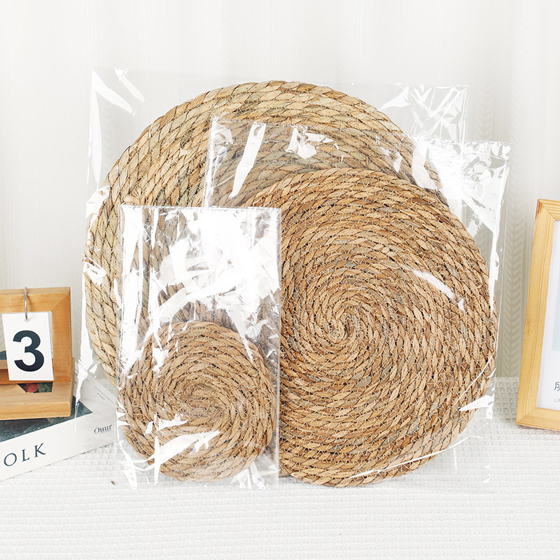 Mesa de comedor de paja tejidas transfronterizas, tapete de aislamiento térmico, posavasos, tapetes de tazón, tapetes de decoración de restaurante, tapetes occidentales, tapetes antideslizantes para la cocina