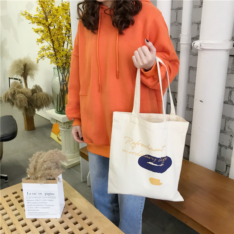E131 canvas bag, Korean-style ins hand-held shoulder bag, color block letter graffiti shopping bag, female student's search for sources undefined