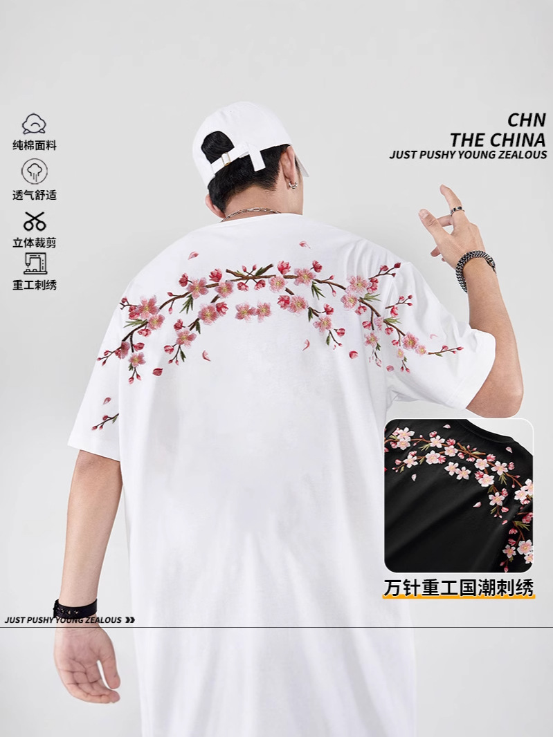 2025 primavera y verano nueva marea nacional marca de moda china suelta flor de ciruelo bordado camiseta de manga corta pareja masculina media manga de verano