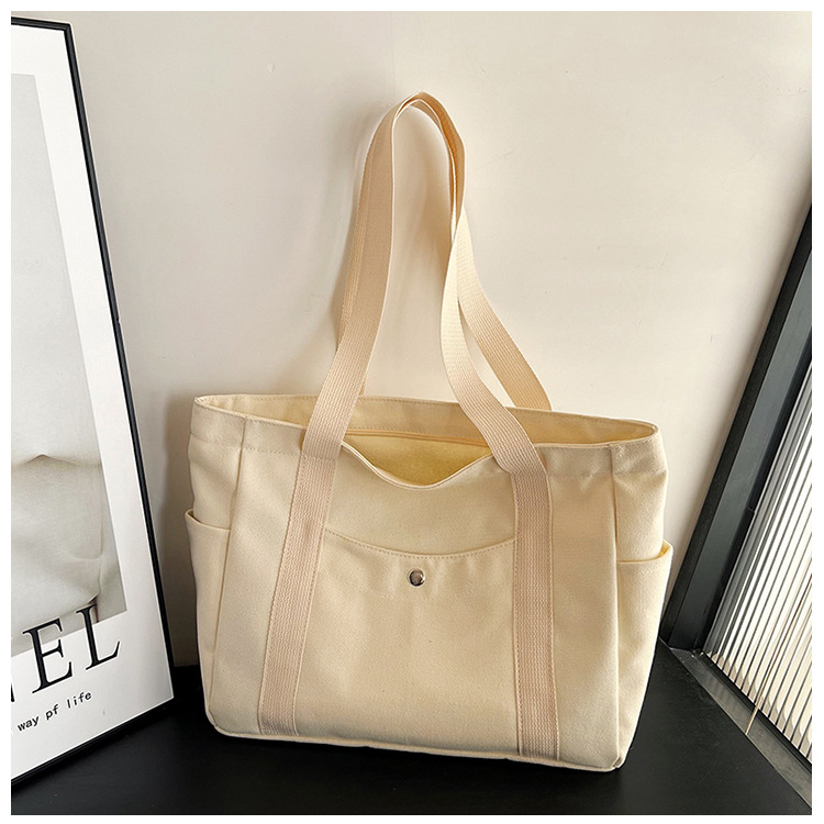 Wholesale of new women's single-shoulder bags, cross-border simple and casual canvas bags, Korean version LOGO printed commuter tote bags undefined