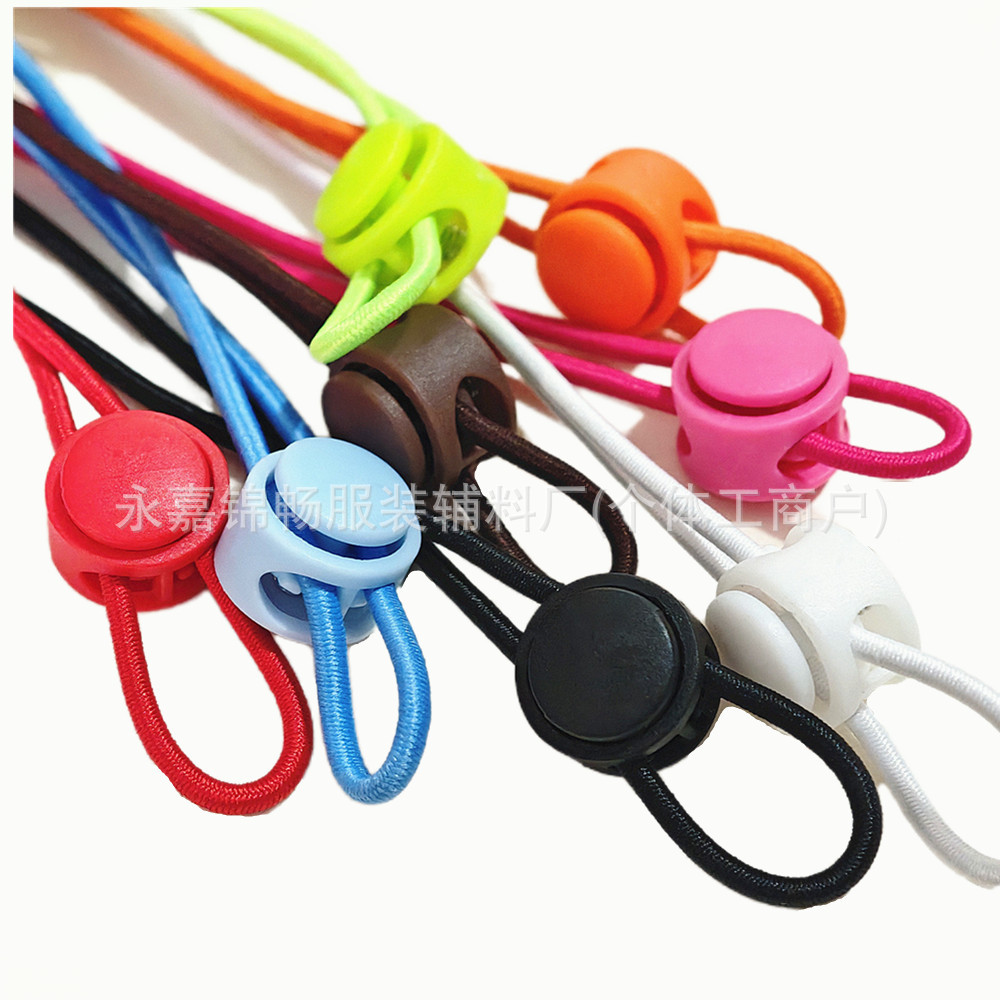 Botón de resorte de color botón de nariz de cerdo de doble agujero de plástico ajustable botón de pan antideslizante cilíndrico botón de cuerda de campana colgante de color sólido