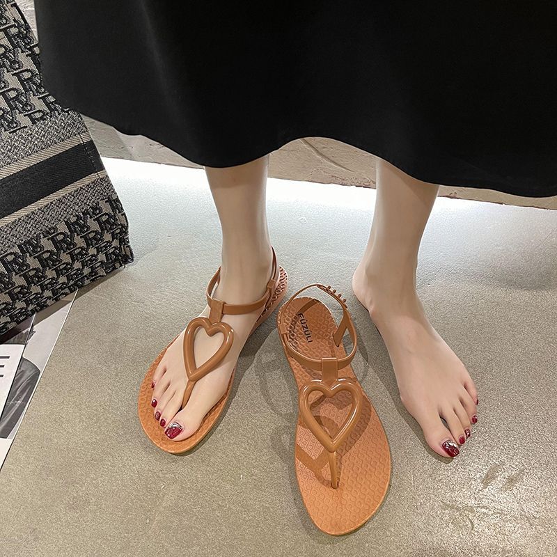 Sandalias planas con chanclas de verano para mujeres francesas 2020 nuevas sandalias coreanas en espina zapatos de playa romanos de todo fósforo para mujeres