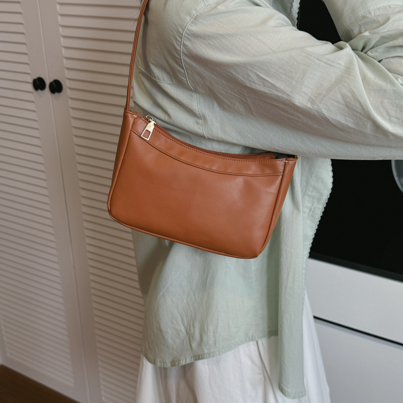 Bolsos de hombro coreanos para niños y niñas, bolsos de moda de color sólido, bolsos portátiles compactos y ligeros, 2026 nuevas bolsas para niños transfronterizas, bolsos de moda