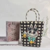 Black beige bucket bag with flower world wine and land labubu