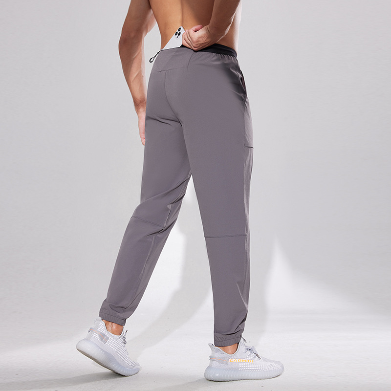 Pantalones deportivos Otoño de los hombres al aire libre de secado rápido pantalones sueltos de nylon tejidos tobillo atado pantalones casuales fitness correr Pantalones