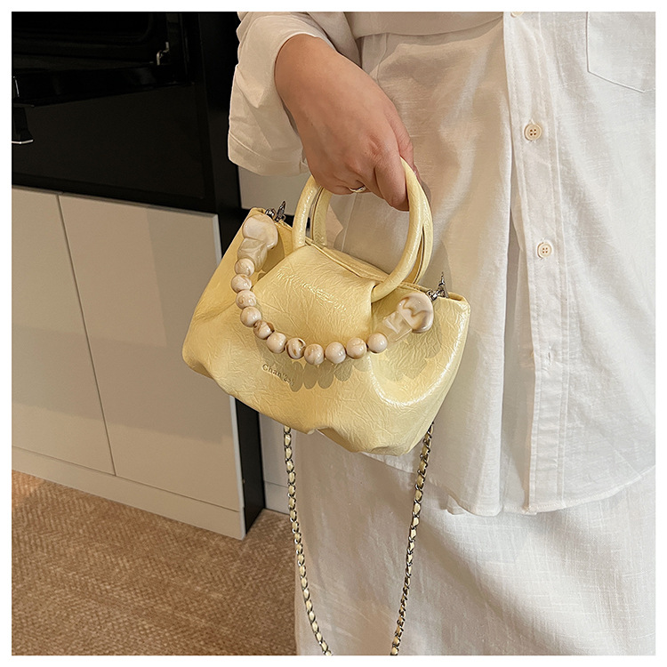 A stylish and trendy beaded bag for women, a new summer chain crossbody cloud bag for women in 2025 undefined