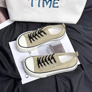 2026 primavera y verano nuevos zapatos de lona de mujer de altura baja con suela gruesa delantera correa de abertura superficial zapatos de lona casuales de estudiantes