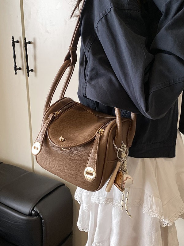 Bolsa de almohada portátil de alta sensación para mujeres 2025 nuevo estilo transfronterizo de moda coreana lichi mochila de hombro