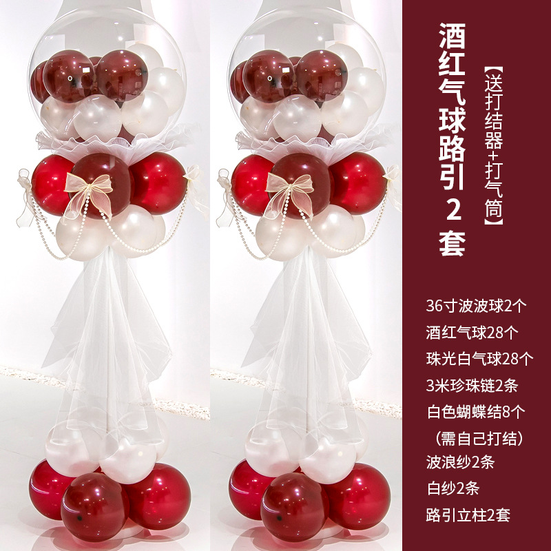 Dos juegos de globos rojos de vino