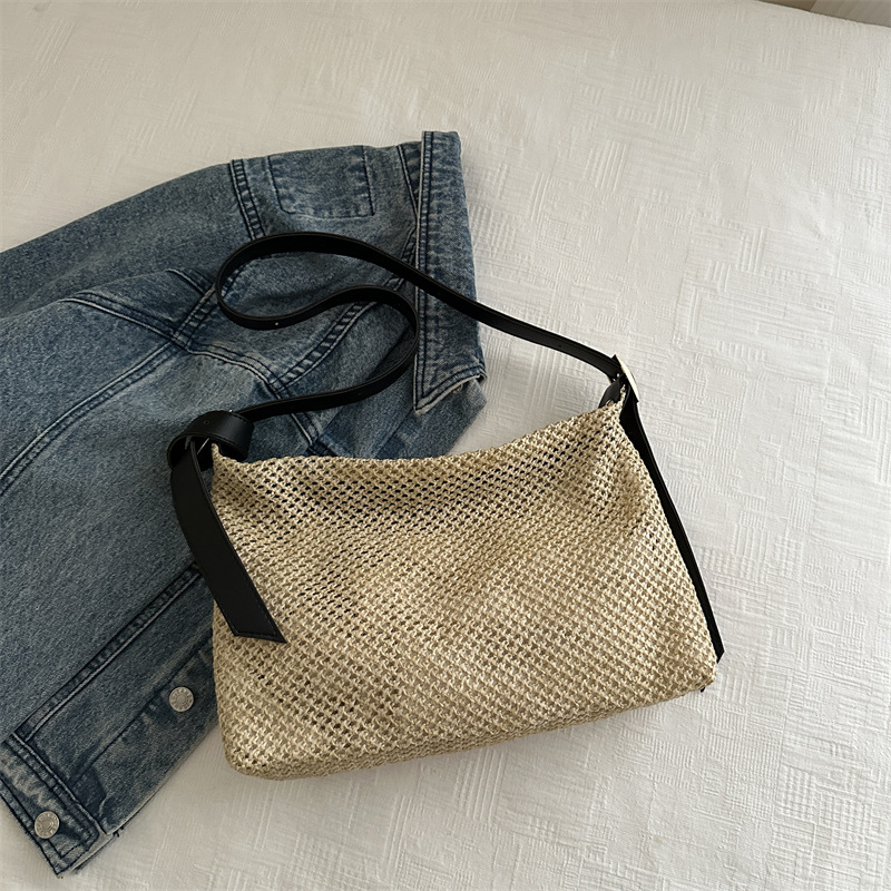 Nicho de alta sensación de bolso de tejido para mujeres 2024 nuevo tipo de viaje al trabajo bolso de paja de hombro de gran capacidad bolso de mochila