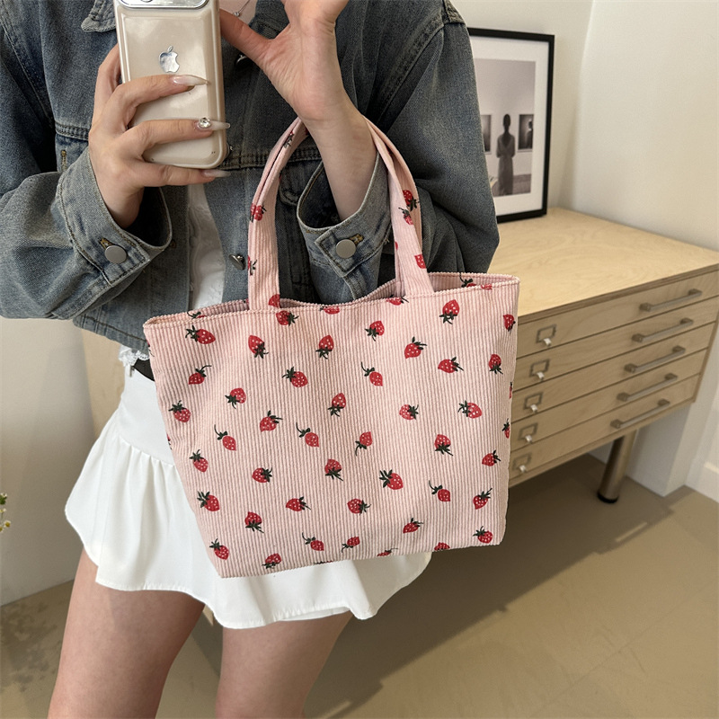 2026 nuevo bolso de transporte de gran capacidad impresión de fresas bolso de hombro de estudiantes