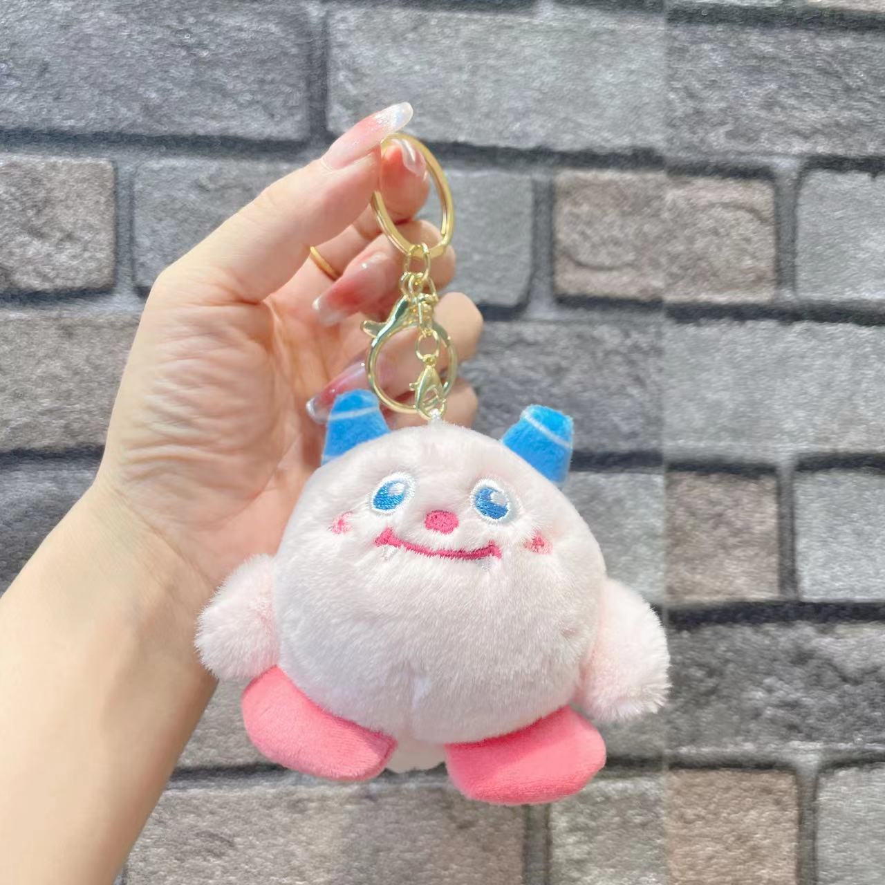 ぬいぐるみのかわいいアクセサリーのぬいぐるみのペンダント卸売りのおもちゃの子供のかばんの漫画の子供の鍵は子供の機械をつかみます。