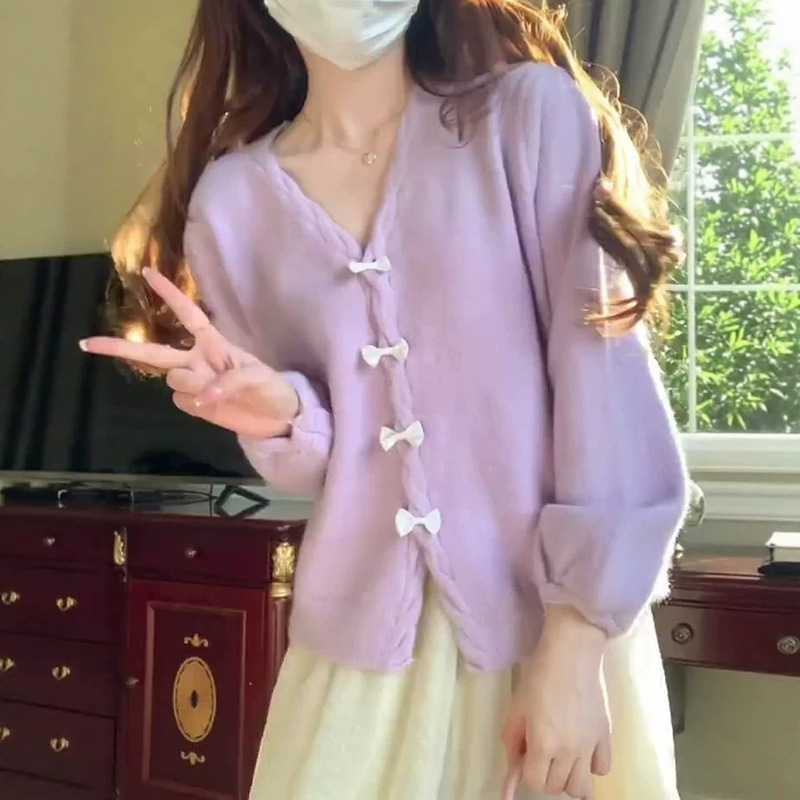 Korean-style light purple knitted cardigan for women, featuring a unique bow detail, button closure, loose fit, and dropped shoulders, creating a gentle and elegant outerwear look