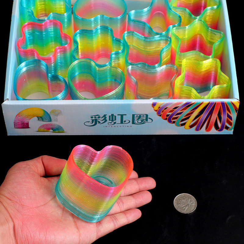 Gran arco iris juguete bobina apilar espectáculo colorido para niños magia estand elástico venta directa al por mayor