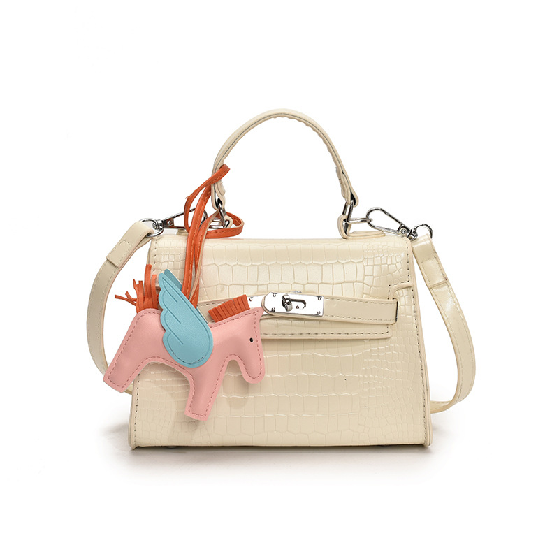 Bolso Kelly de mano de alta gama para mujer 2025 nueva moda casual bolso de hombro con patrón de piedra moda bolso de mensajero de color sólido