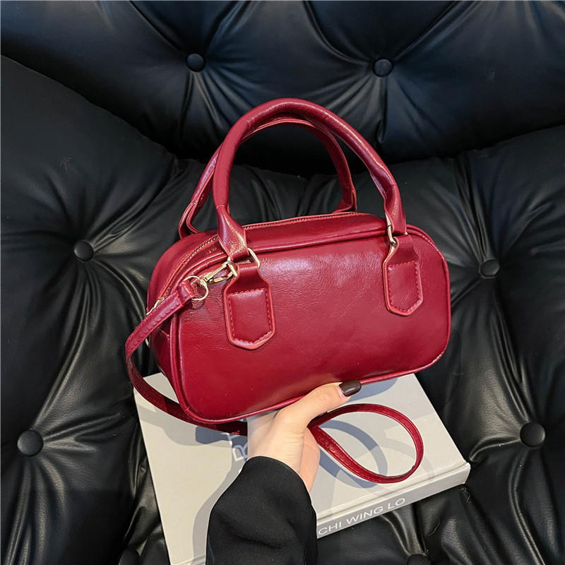 Versión coreana del bolso pequeño de Boston otoño e invierno nuevo bolso portátil para las axilas bolso de bolos literario de moda bolso diagonal de un solo hombro