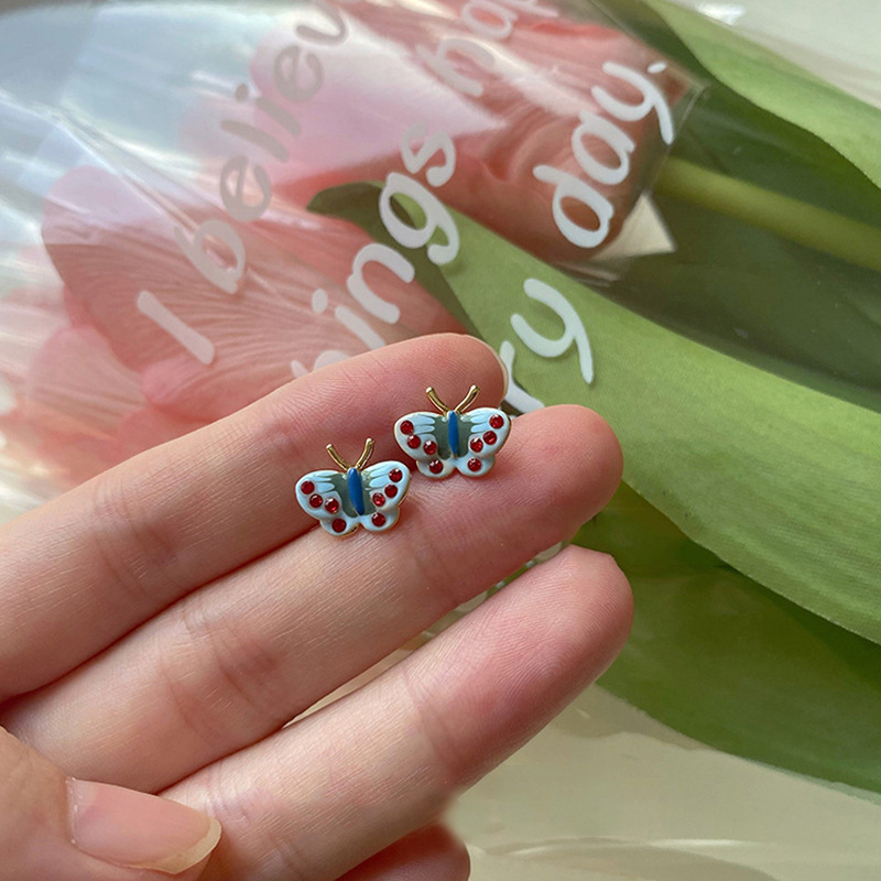 Painted retro enamel with butterfly