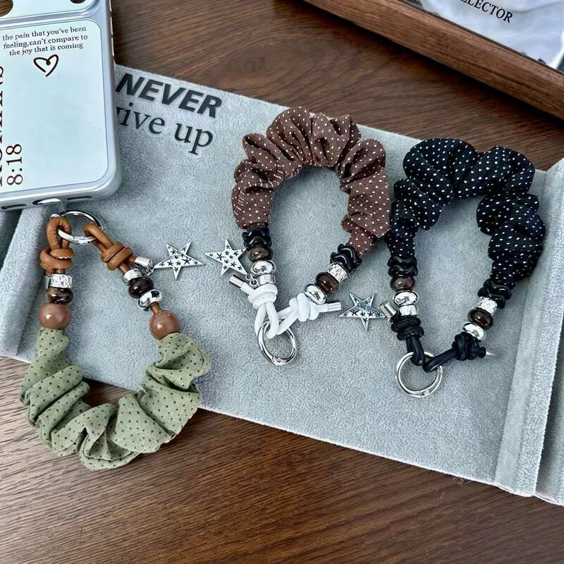Korean-style polka dot fabric phone strap with a retro star pendant, short wrist cord, and keychain charm – wholesale