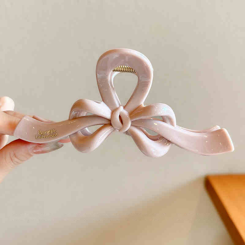 Temperamento arco flotante clip para el cabello de mujer cantidad de diseño de clip de tiburón tarjeta de cabello detrás de la cabeza agarrar clip para el cabello