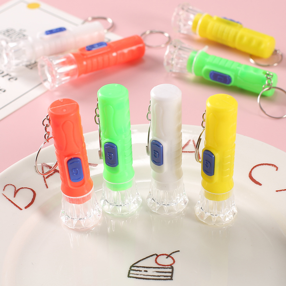 Small luminous flashlight, portable keychain for kindergarten and primary school students, opening ceremony gift, wholesale.