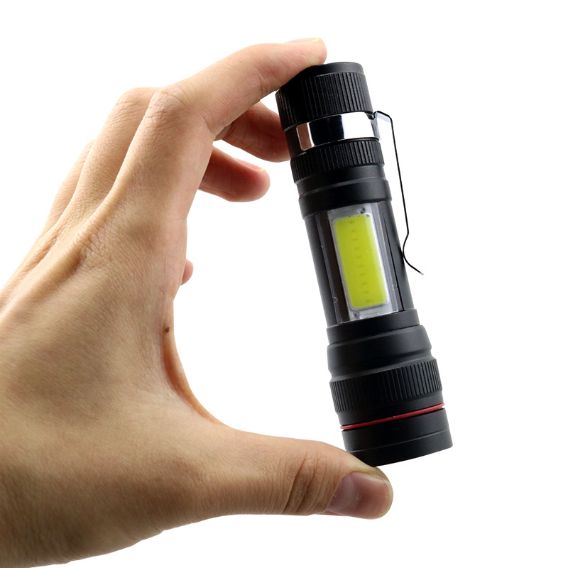 Mini T6 linterna de luz fuerte incorporada 18650 batería de litio telescópica zoom luz lateral COB con titular de la pluma pequeño portátil al por mayor