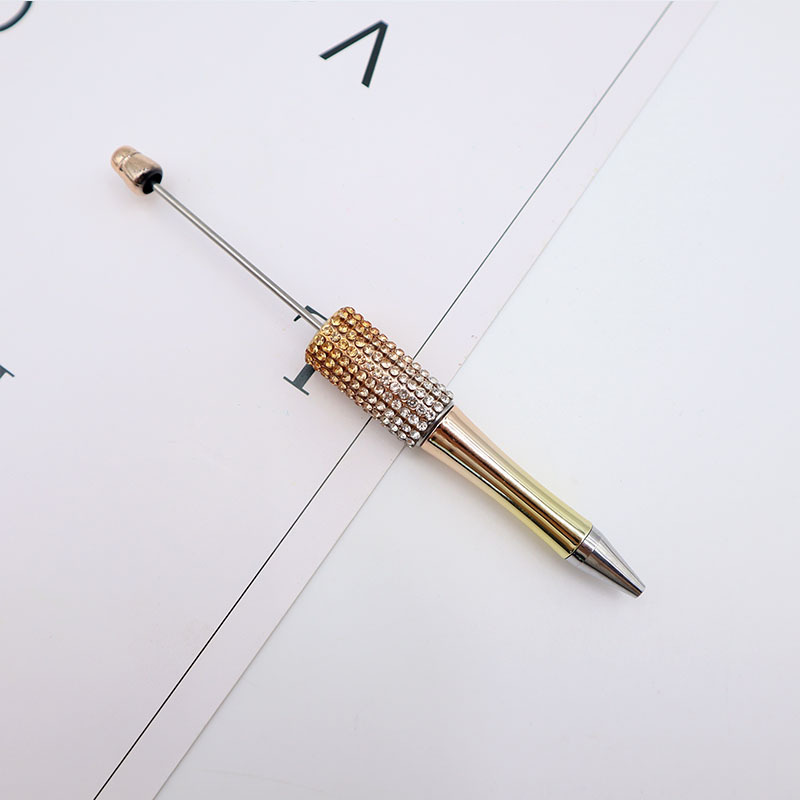 Bolígrafo giratorio de grano lindo de color degradado de tendencia de alto valor Bolígrafo de gomas galvanizado con cuentas de diamantes de bricolaje creativo