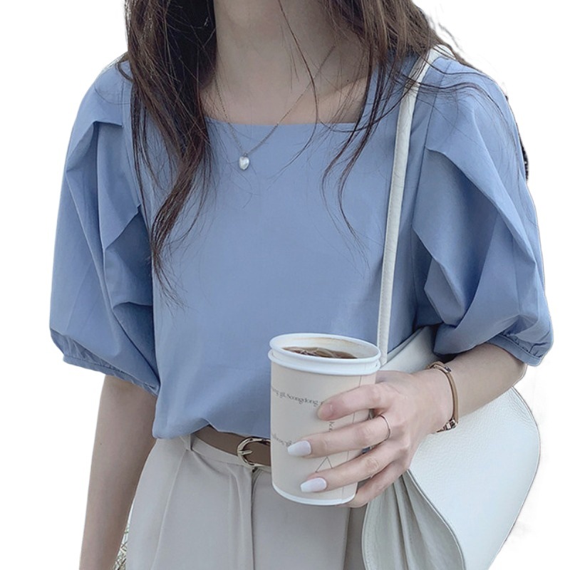 シャツのフランスの方襟の泡の袖の上着の女性の韓風のchiの薄いタイプのデザイン感の小さい大衆の半袖のシャツの女性はゆったりしています。