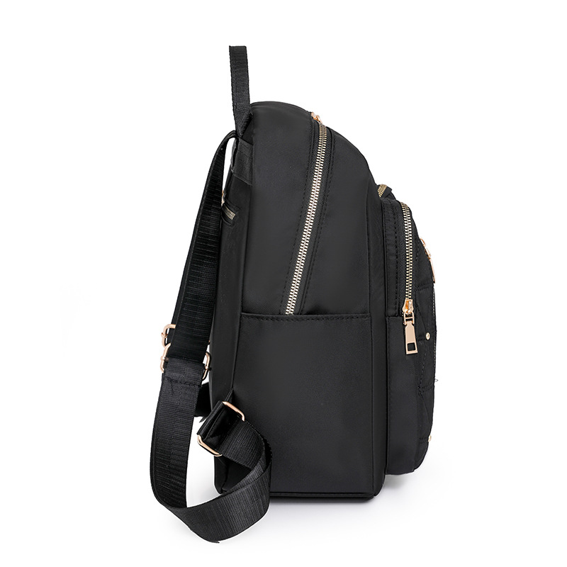 Mochila de nailon bordada de rombo para mujer 2024 nuevo estilo casual para mujer mochila de viaje ligero para viajeros urbanos