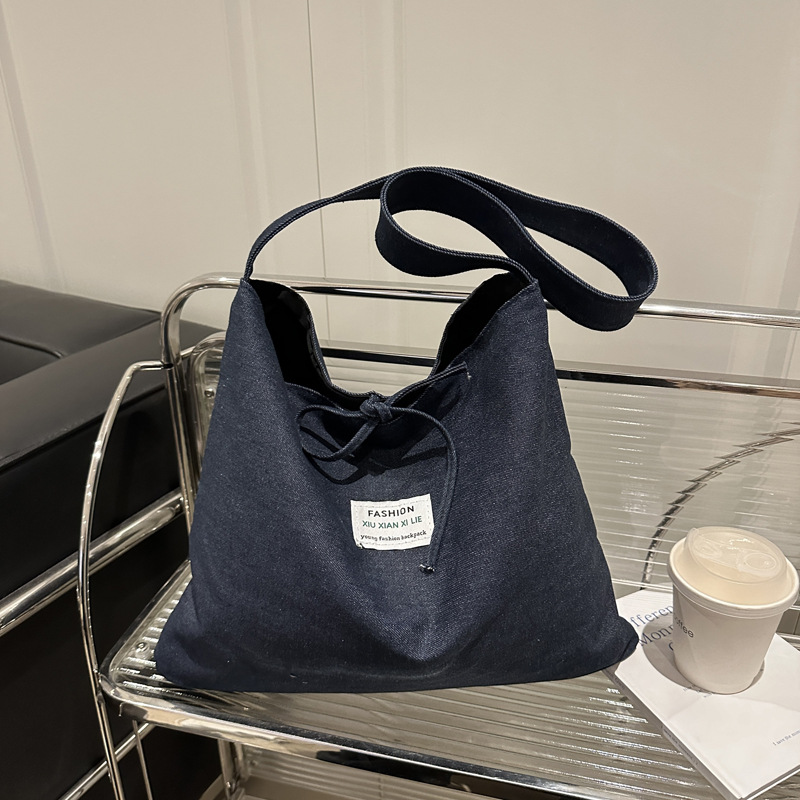 2025 primavera y verano estilo nacional denim tendencia nueva mochila de hombro de gran capacidad mochila de pulsación de la moda