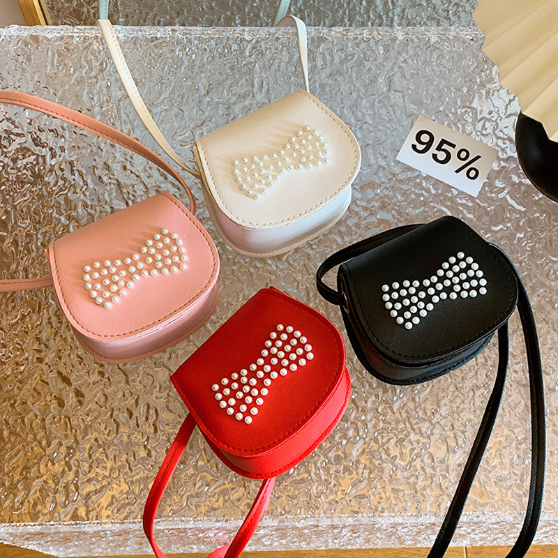 Bolsos de hombro coreanos para niños y niñas, estilo extranjero mini arco de perlas, bolsos de mochila para niños, 2024 nuevos bolsos para niños