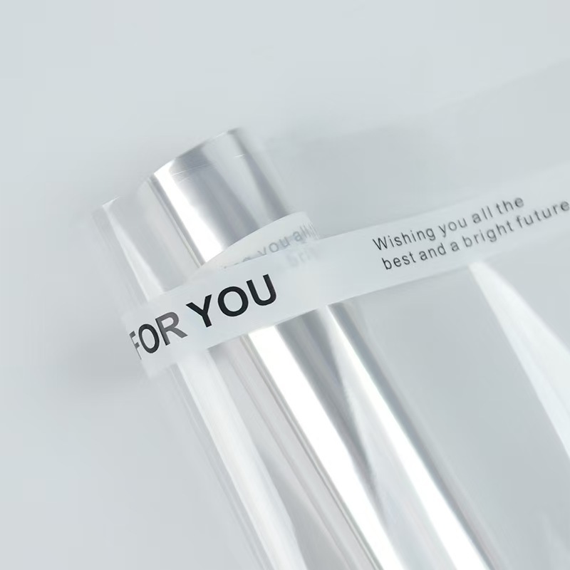 Celofán a prueba de polvo al por mayor opp forro de plástico de papel de embalaje de flores paquete de ramo celofán transparente en stock