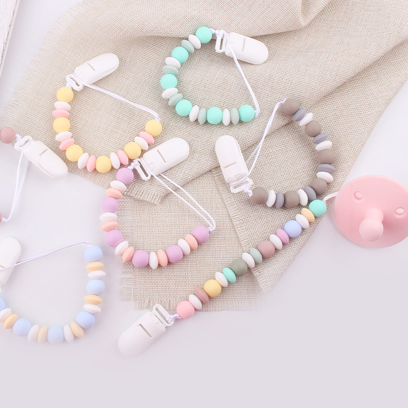 Nuevos productos para bebés cadena de tetas para calmar al bebé dibujos animados DIY color silicona mordida cadena de tetas cadena anti-caída cadena